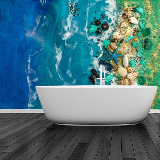 Fototapeta niebieskie morze z kamieniami inspiracja do łazienki